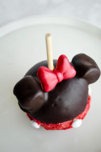 Minnie Mouse Chocolate Covered Caramel Apple // magicaltreatsathome.com