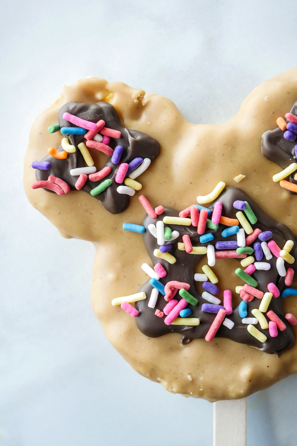 Mickey Mouse Peanut Butter Rice Krispie Treat Pops // magicaltreatsathome.com